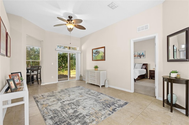 727 Grape Ivy Ln, New Smyrna Beach, FL 32168 - sitting room with light tile patterned floors and ceiling fan