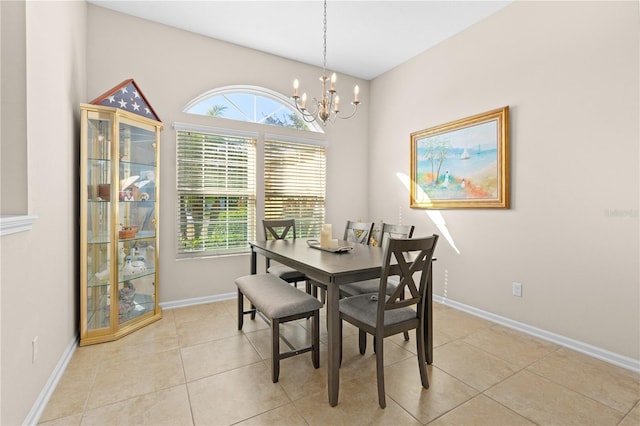 727 Grape Ivy Ln, New Smyrna Beach, FL 32168 - dining space with a chandelier and light tile patterned flooring
