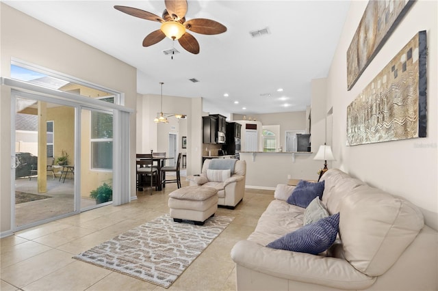 727 Grape Ivy Ln, New Smyrna Beach, FL 32168 - living room featuring ceiling fan, healthy amount of natural light, light tile patterned flooring, and recessed lighting