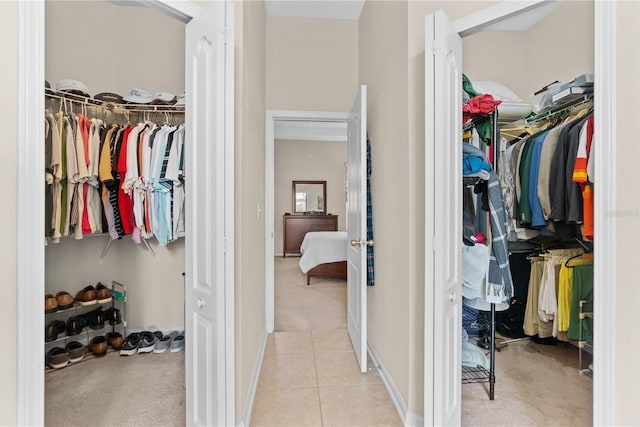 727 Grape Ivy Ln, New Smyrna Beach, FL 32168 - walk in closet featuring light tile patterned flooring