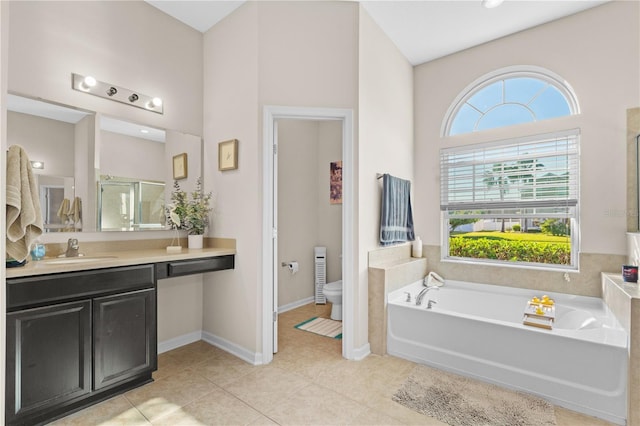 727 Grape Ivy Ln, New Smyrna Beach, FL 32168 - bathroom with a shower stall, a garden tub, vanity, and tile patterned flooring