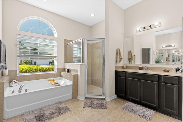 727 Grape Ivy Ln, New Smyrna Beach, FL 32168 - bathroom featuring vanity, a garden tub, a shower stall, and tile patterned floors