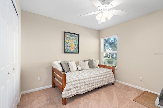 727 Grape Ivy Ln, New Smyrna Beach, FL 32168 - bedroom with carpet floors, a closet, and a ceiling fan