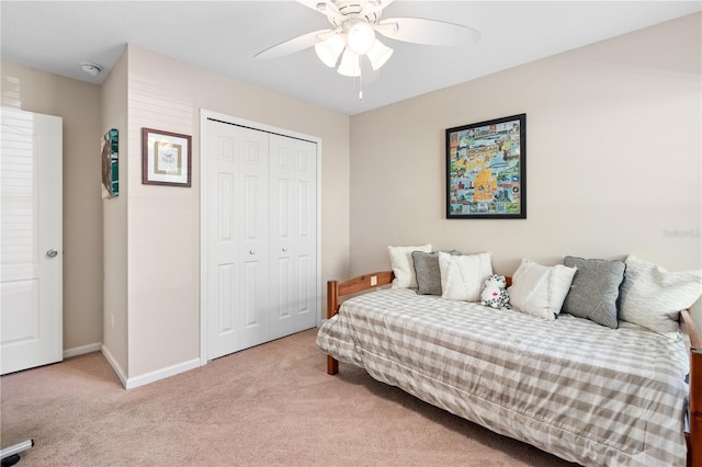 727 Grape Ivy Ln, New Smyrna Beach, FL 32168 - carpeted bedroom with a closet and a ceiling fan