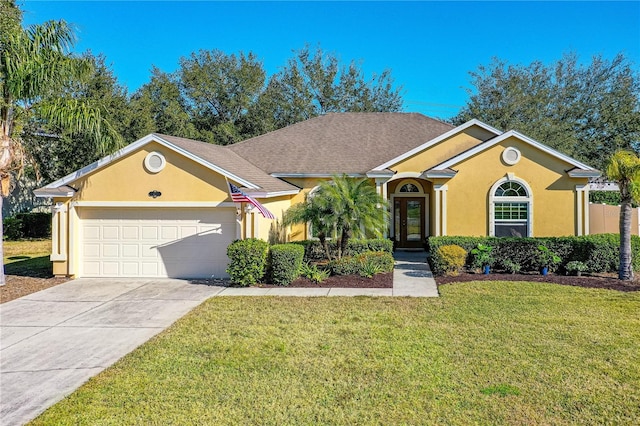 727 Grape Ivy Ln, New Smyrna Beach, FL 32168 - view of front of home featuring stucco siding, an attached garage, a front lawn, and concrete driveway