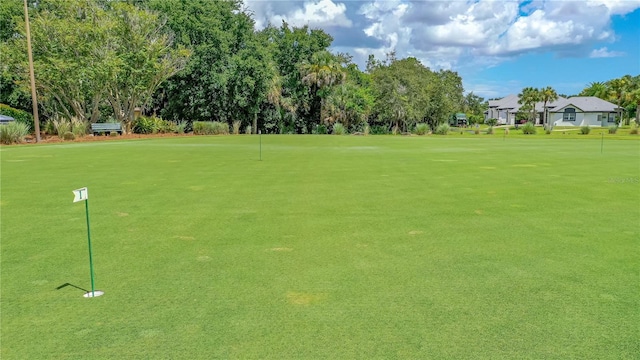 727 Grape Ivy Ln, New Smyrna Beach, FL 32168 - view of home's community featuring a putting area, view of wooded area, and golf course view