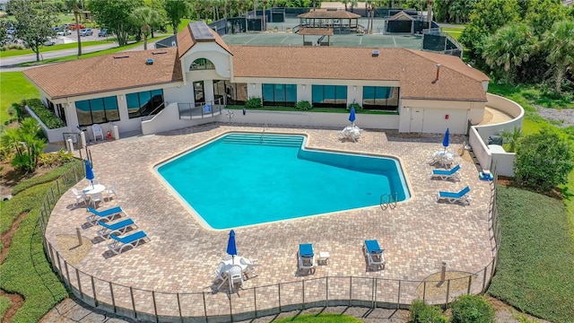 727 Grape Ivy Ln, New Smyrna Beach, FL 32168 - community pool featuring a patio