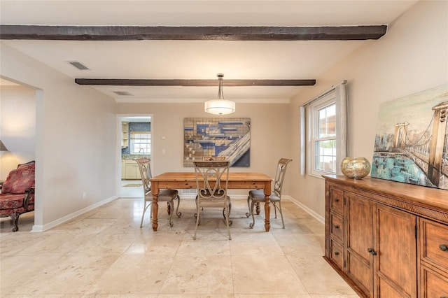 2724 N Halifax Ave, Daytona Beach, FL 32118 - dining room featuring beamed ceiling and baseboards