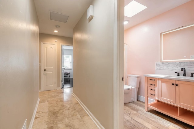 2724 N Halifax Ave, Daytona Beach, FL 32118 - hallway with a sink and a skylight