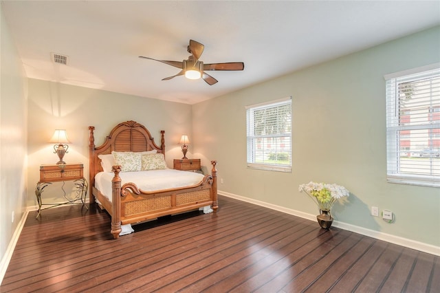 2724 N Halifax Ave, Daytona Beach, FL 32118 - bedroom with wood-type flooring, multiple windows, and a ceiling fan