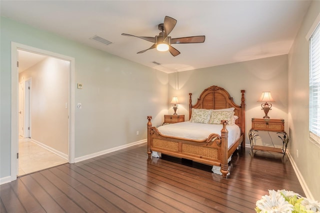 2724 N Halifax Ave, Daytona Beach, FL 32118 - bedroom with wood finished floors, multiple windows, and a ceiling fan