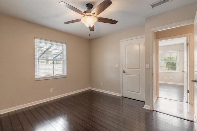 2724 N Halifax Ave, Daytona Beach, FL 32118 - empty room with a ceiling fan and dark wood finished floors