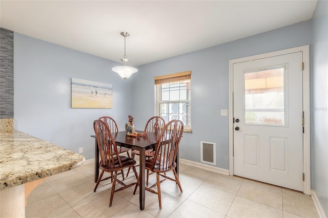 2724 N Halifax Ave, Daytona Beach, FL 32118 - dining room with baseboards and light tile patterned flooring