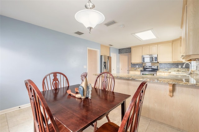 2724 N Halifax Ave, Daytona Beach, FL 32118 - dining area with light tile patterned floors