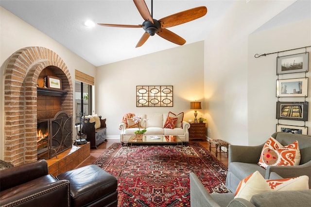 1261 Burning Tree Ln, Winter Park, FL 32792 - living area with vaulted ceiling, wood finished floors, a ceiling fan, and a fireplace
