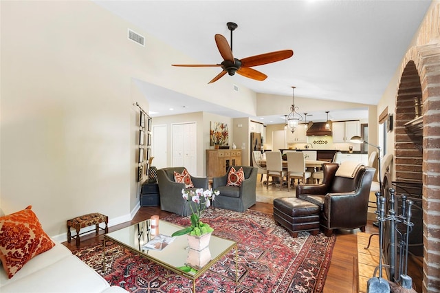 1261 Burning Tree Ln, Winter Park, FL 32792 - living room with wood finished floors, vaulted ceiling, and ceiling fan