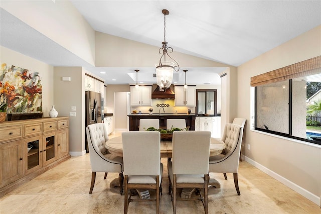 1261 Burning Tree Ln, Winter Park, FL 32792 - dining room featuring vaulted ceiling and a chandelier
