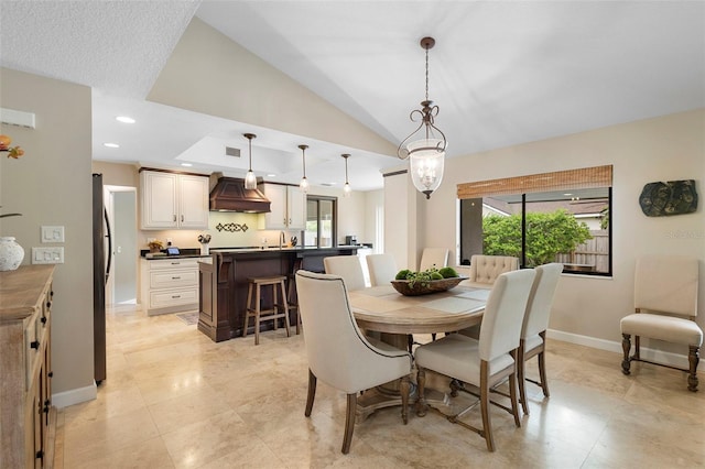1261 Burning Tree Ln, Winter Park, FL 32792 - dining area with plenty of natural light, vaulted ceiling, light tile patterned flooring, and recessed lighting