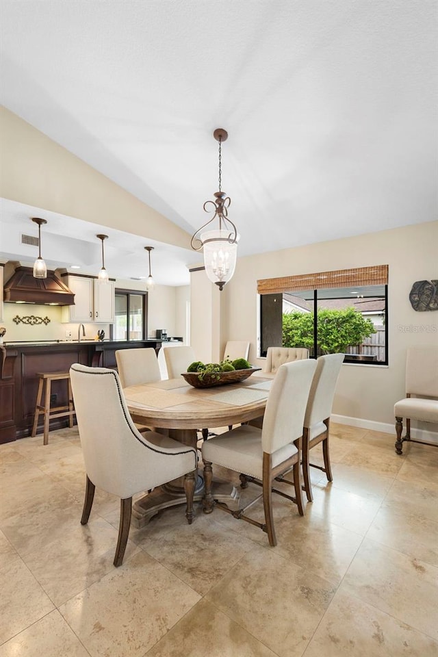 1261 Burning Tree Ln, Winter Park, FL 32792 - dining area with plenty of natural light, lofted ceiling, and a chandelier