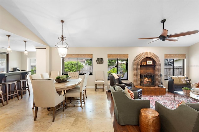 1261 Burning Tree Ln, Winter Park, FL 32792 - living area with healthy amount of natural light, a fireplace, and a ceiling fan