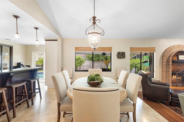1261 Burning Tree Ln, Winter Park, FL 32792 - dining space featuring a fireplace