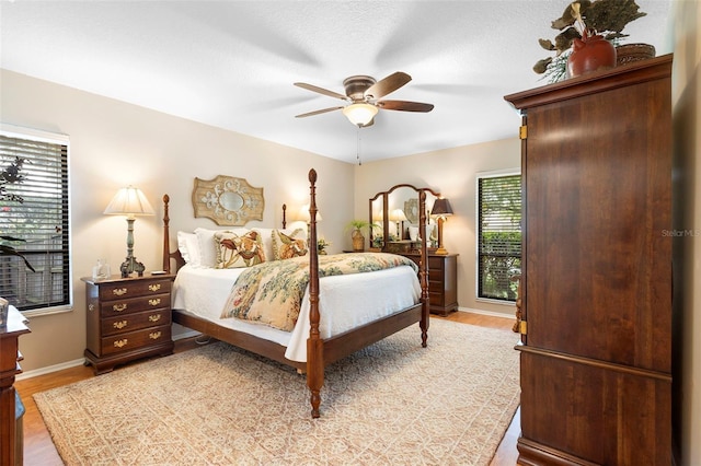1261 Burning Tree Ln, Winter Park, FL 32792 - bedroom with light wood-style flooring and ceiling fan