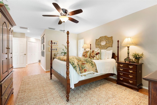 1261 Burning Tree Ln, Winter Park, FL 32792 - bedroom featuring light wood-style flooring, a closet, and a ceiling fan
