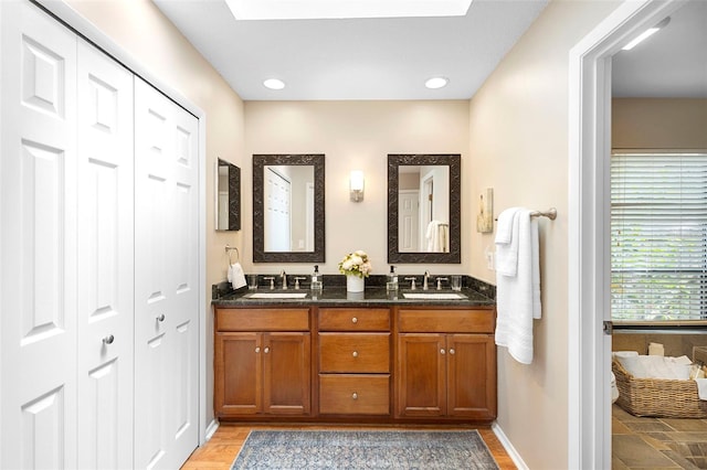 1261 Burning Tree Ln, Winter Park, FL 32792 - bathroom featuring double vanity and a closet