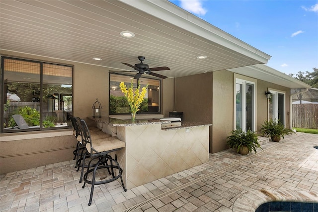 1261 Burning Tree Ln, Winter Park, FL 32792 - view of patio featuring an outdoor bar and a ceiling fan