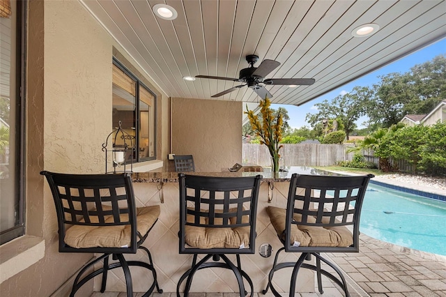 1261 Burning Tree Ln, Winter Park, FL 32792 - fenced backyard with a patio area and a ceiling fan