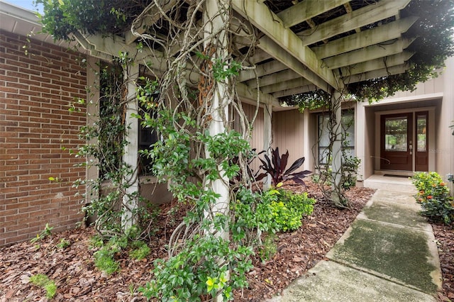 1261 Burning Tree Ln, Winter Park, FL 32792 - doorway to property with brick siding