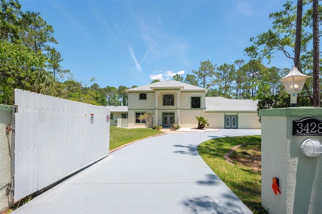3428 Longleaf Rd, Ormond Beach, FL 32174 - mediterranean / spanish home with stucco siding and curved driveway