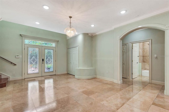 3428 Longleaf Rd, Ormond Beach, FL 32174 - entryway with arched walkways, french doors, recessed lighting, stairs, and ornamental molding