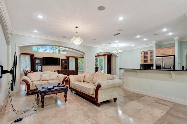 3428 Longleaf Rd, Ormond Beach, FL 32174 - living room with arched walkways, a chandelier, healthy amount of natural light, crown molding, and recessed lighting
