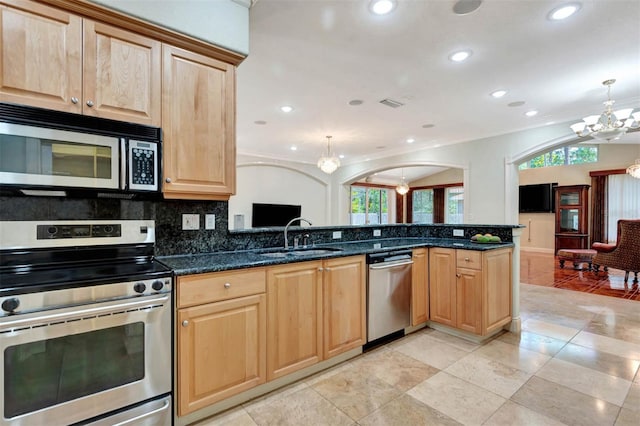 3428 Longleaf Rd, Ormond Beach, FL 32174 - kitchen with stainless steel appliances, a chandelier, light brown cabinetry, healthy amount of natural light, and recessed lighting