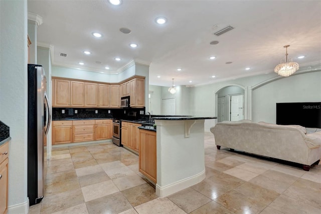 3428 Longleaf Rd, Ormond Beach, FL 32174 - kitchen with ornamental molding, a peninsula, open floor plan, light brown cabinets, and arched walkways