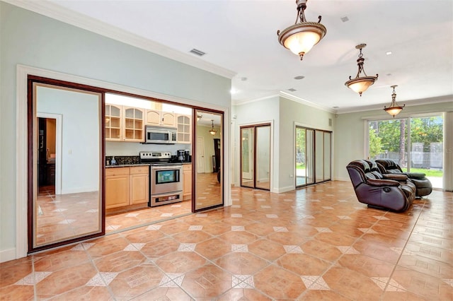 3428 Longleaf Rd, Ormond Beach, FL 32174 - kitchen with stainless steel appliances, light tile patterned floors, dark countertops, open floor plan, and crown molding