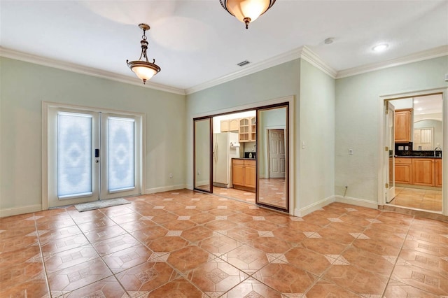 3428 Longleaf Rd, Ormond Beach, FL 32174 - spare room featuring french doors, crown molding, and light tile patterned floors
