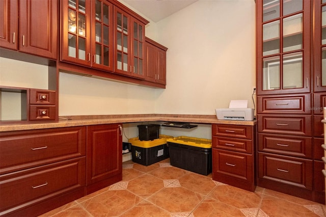 3428 Longleaf Rd, Ormond Beach, FL 32174 - unfurnished office with built in desk and light tile patterned floors