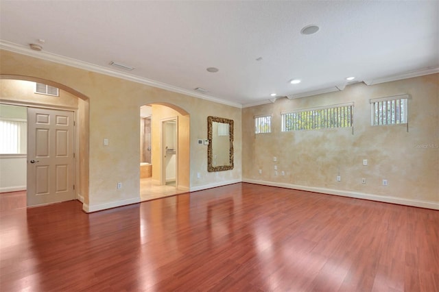 3428 Longleaf Rd, Ormond Beach, FL 32174 - unfurnished room with wood finished floors, arched walkways, plenty of natural light, crown molding, and recessed lighting