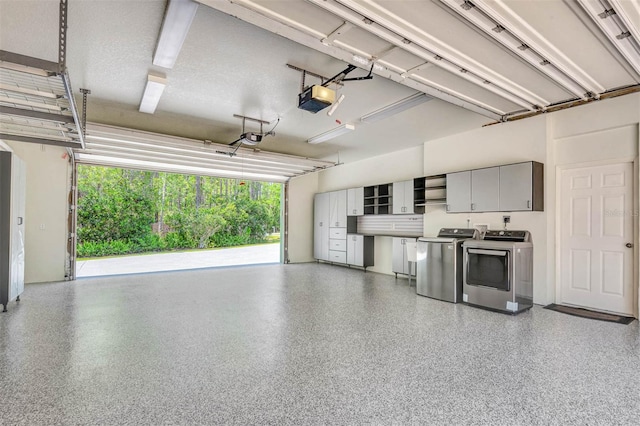 3428 Longleaf Rd, Ormond Beach, FL 32174 - garage featuring washing machine and dryer and a garage door opener