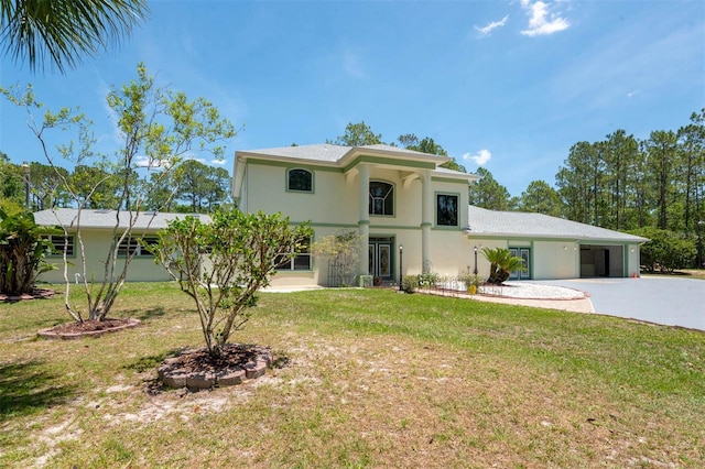 3428 Longleaf Rd, Ormond Beach, FL 32174 - mediterranean / spanish-style house with stucco siding, concrete driveway, a front lawn, and a carport