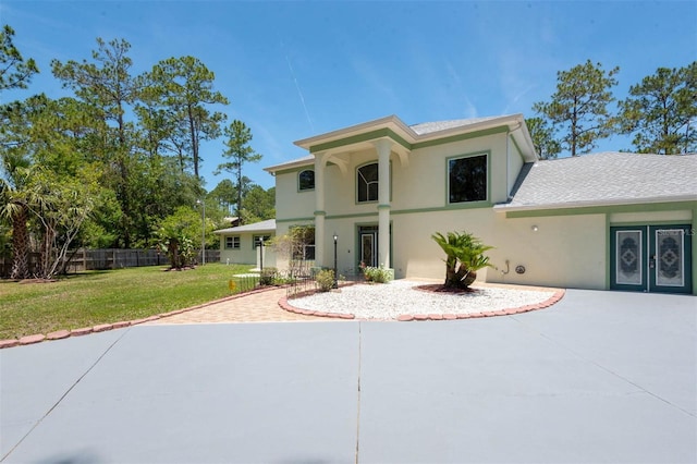 3428 Longleaf Rd, Ormond Beach, FL 32174 - view of front of house featuring stucco siding, a patio, and a shingled roof