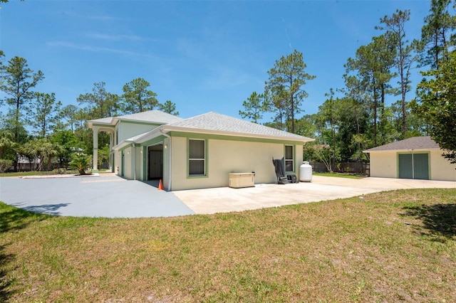 3428 Longleaf Rd, Ormond Beach, FL 32174 - back of house with a patio and stucco siding