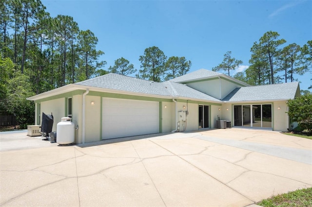 3428 Longleaf Rd, Ormond Beach, FL 32174 - view of front of home featuring stucco siding, an attached garage, driveway, and a shingled roof