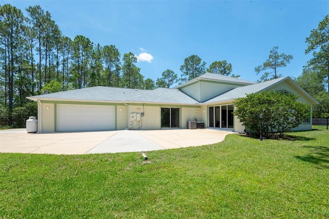 3428 Longleaf Rd, Ormond Beach, FL 32174 - view of front of property with an attached garage, a front yard, stucco siding, concrete driveway, and a shingled roof