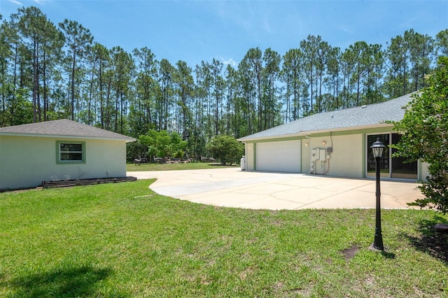 3428 Longleaf Rd, Ormond Beach, FL 32174 - view of grassy yard with an attached garage and driveway