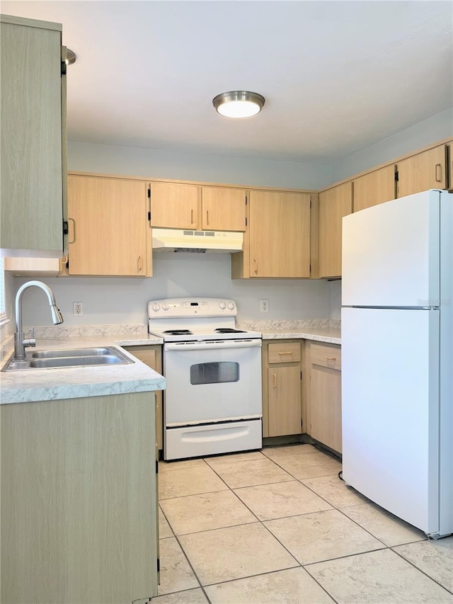 632 W Hubbard Ave, Deland, FL 32720 - kitchen with white appliances, under cabinet range hood, light brown cabinets, and light countertops
