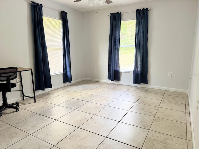 632 W Hubbard Ave, Deland, FL 32720 - spare room featuring light tile patterned flooring and a ceiling fan