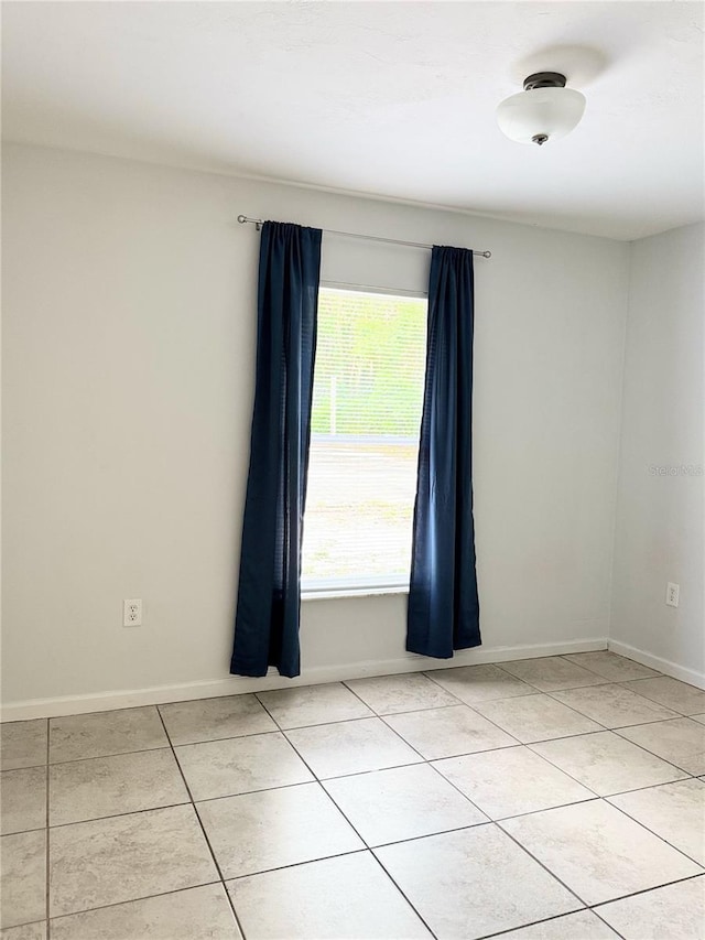 632 W Hubbard Ave, Deland, FL 32720 - unfurnished room with light tile patterned floors and baseboards